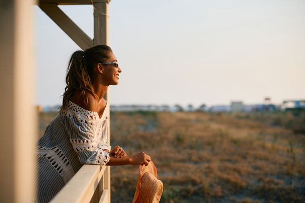 carefree woman enjoying the view from a terrace